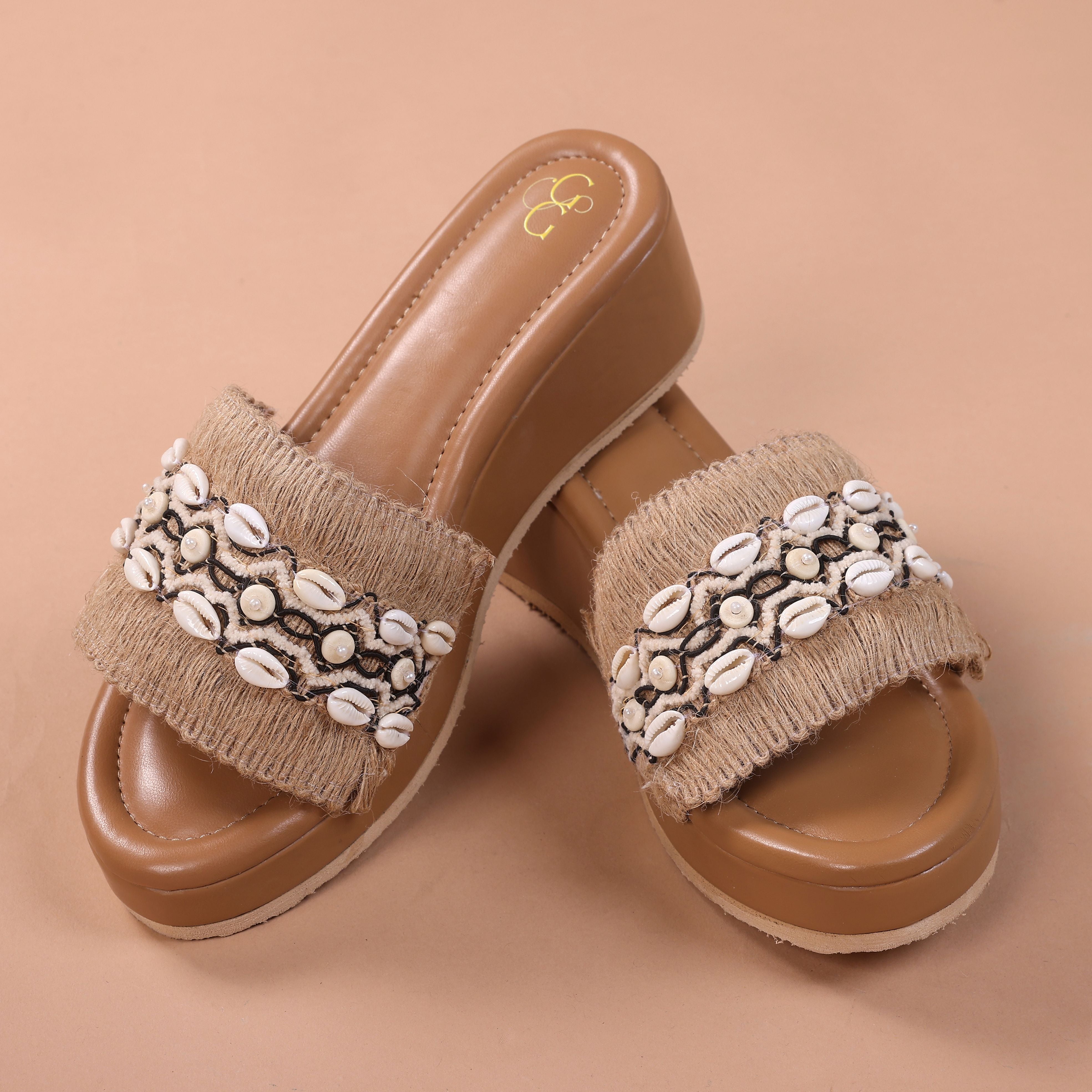 Heels jute sequence with cowrie shells